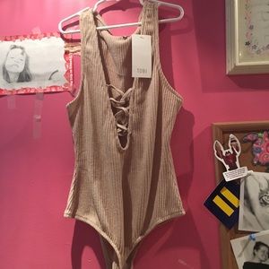 tan body suit